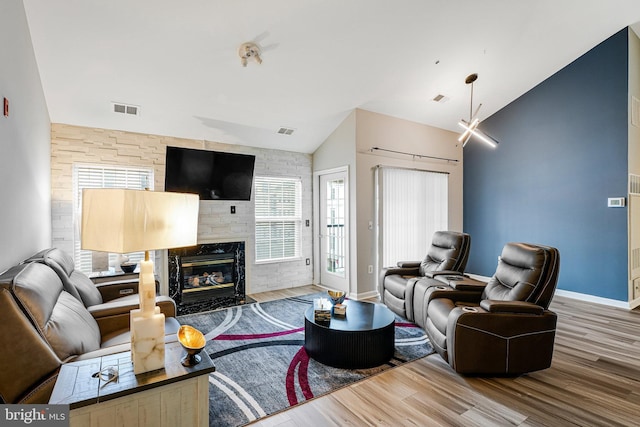 11575 Cavalier Landing Ct Unit 402, Fairfax, VA 22030 - living room with visible vents, baseboards, wood finished floors, and lofted ceiling
