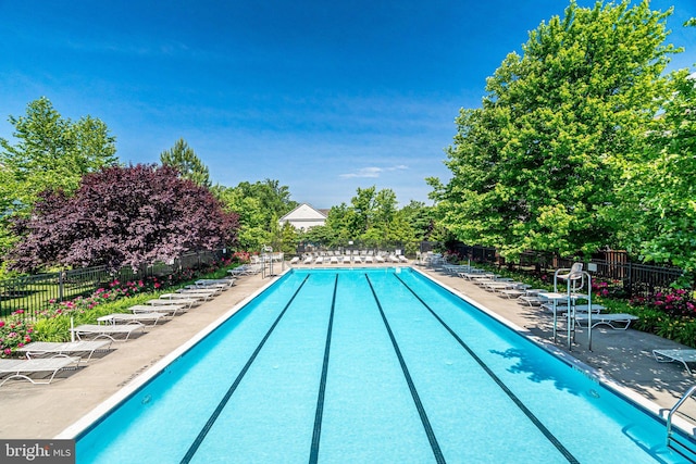 11575 Cavalier Landing Ct Unit 402, Fairfax, VA 22030 - pool featuring a patio and fence