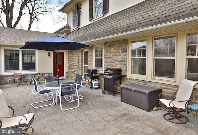 view of patio featuring grilling area and outdoor dining space