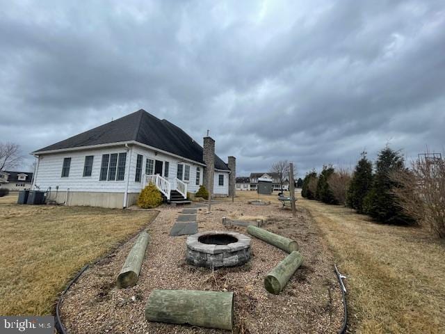 125 Hillview Rd, Kunkletown, PA 18058 - back of house with an outdoor fire pit and a chimney
