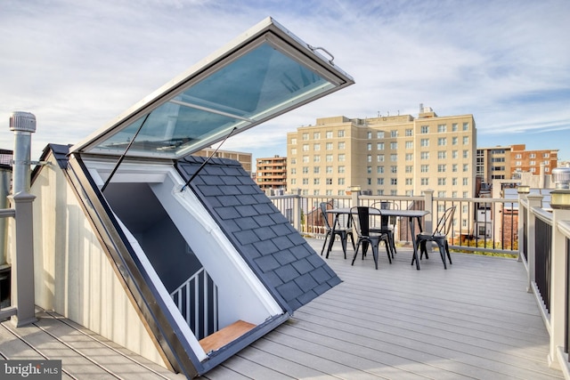 wooden deck with a view of city