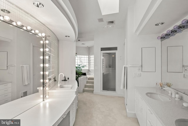 910 Pennwood Cir, Lancaster, PA 17601 - full bathroom with double vanity, a shower stall, a bath, and a skylight