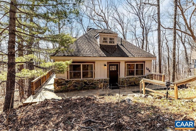 145 Firtree Dr, Wintergreen Resort, VA 22967 - view of front facade featuring stone siding and fence