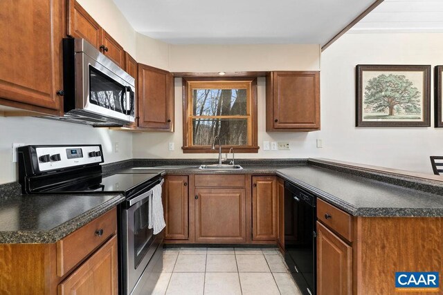 145 Firtree Dr, Wintergreen Resort, VA 22967 - kitchen with dark countertops, a peninsula, stainless steel appliances, and a sink