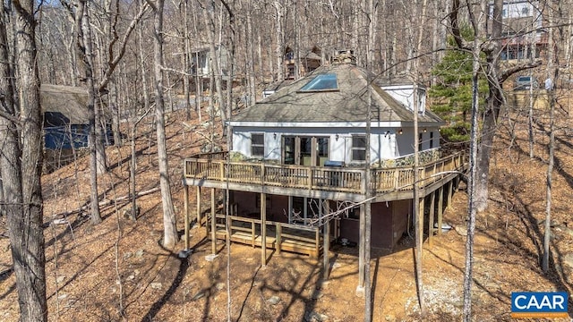 145 Firtree Dr, Wintergreen Resort, VA 22967 - back of property with a wooden deck, a chimney, and a shingled roof
