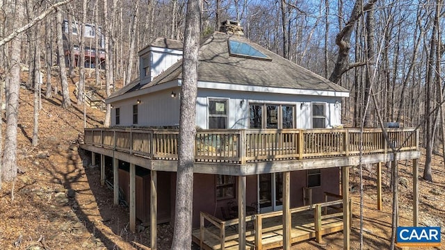 145 Firtree Dr, Wintergreen Resort, VA 22967 - back of house with a chimney, a shingled roof, and a deck