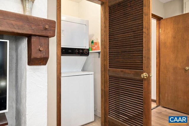 145 Firtree Dr, Wintergreen Resort, VA 22967 - laundry room featuring laundry area, stacked washer / drying machine, and wood finished floors