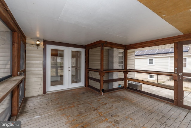 deck with french doors and cooling unit