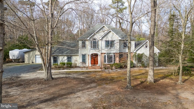 view of front of home with an outbuilding and driveway