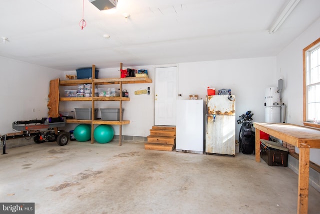 garage featuring a garage door opener and freestanding refrigerator