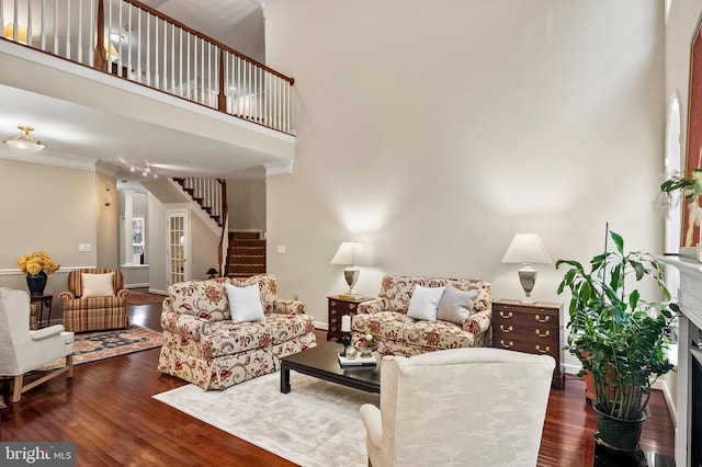 8725 Warm Waves Way Unit 10, Columbia, MD 21045 - living area featuring stairway, wood finished floors, baseboards, and a high ceiling