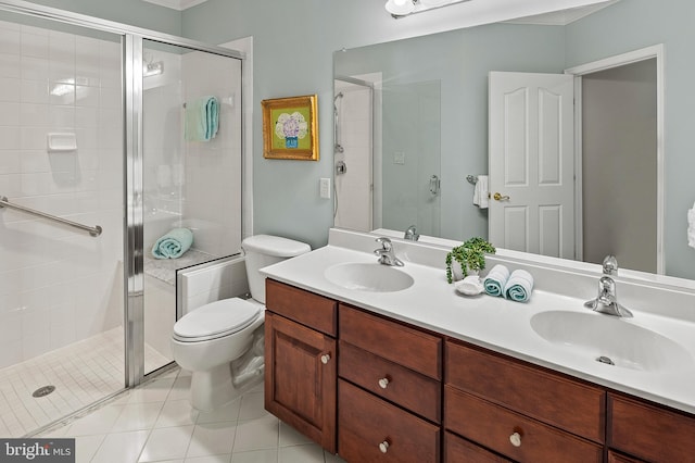 8725 Warm Waves Way Unit 10, Columbia, MD 21045 - bathroom with a shower stall, double vanity, toilet, and tile patterned floors