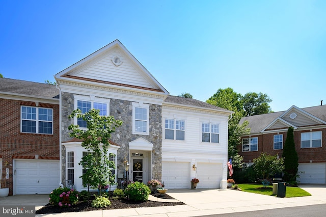 8725 Warm Waves Way Unit 10, Columbia, MD 21045 - view of front facade featuring driveway, a garage, and stone siding