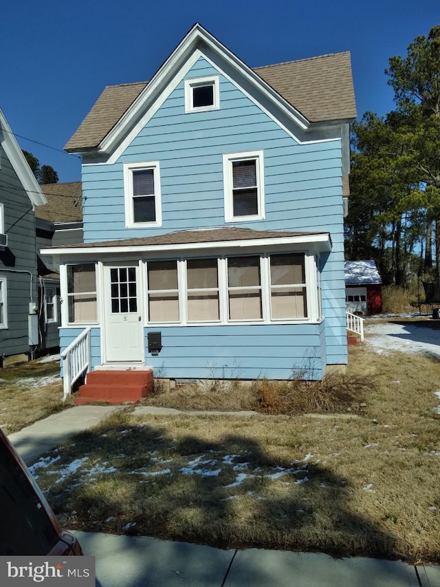 view of front of house with a shingled roof