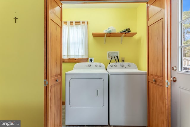 laundry area featuring separate washer and dryer and laundry area