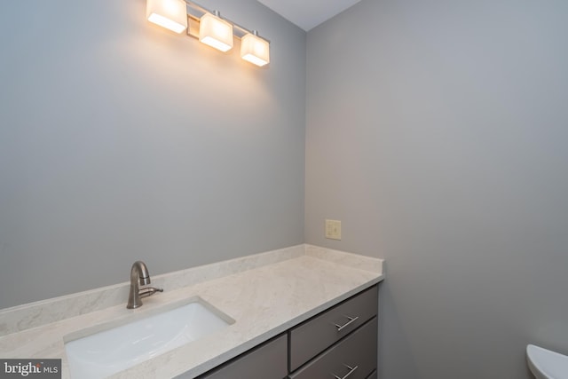 half bath with vanity and toilet