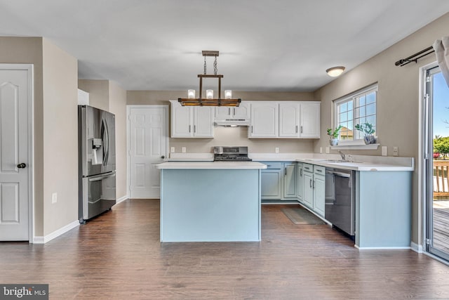4735 Queens Grove St, White Plains, MD 20695 - kitchen with a center island, light countertops, appliances with stainless steel finishes, and under cabinet range hood