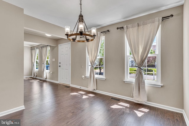 4735 Queens Grove St, White Plains, MD 20695 - unfurnished dining area with baseboards, an inviting chandelier, wood finished floors, and visible vents