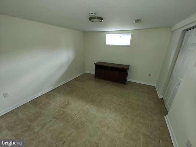 interior space with baseboards and visible vents