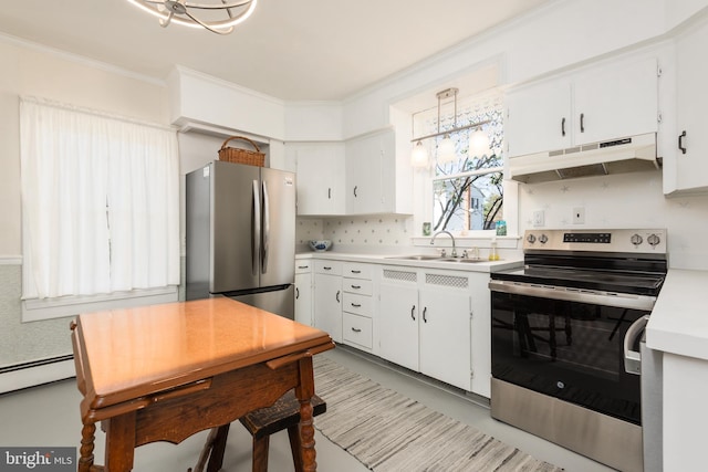 100 Wall St, Queenstown, MD 21658 - kitchen featuring light countertops, crown molding, under cabinet range hood, a sink, and appliances with stainless steel finishes