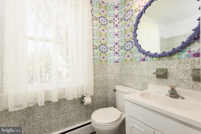 100 Wall St, Queenstown, MD 21658 - half bathroom featuring tile walls, toilet, and vanity