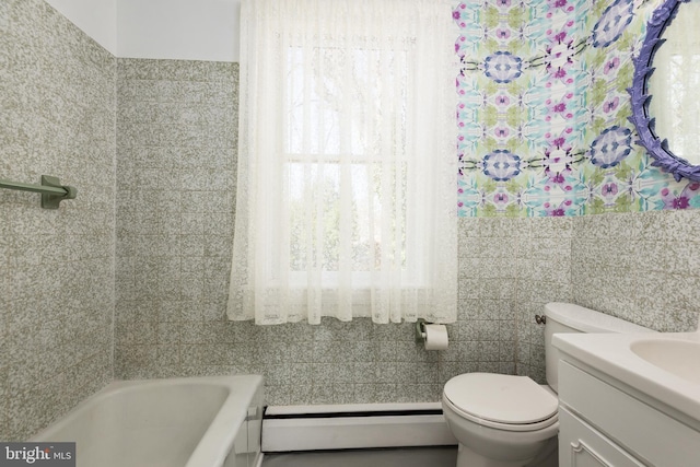 100 Wall St, Queenstown, MD 21658 - full bathroom featuring a baseboard radiator, toilet, a tub to relax in, and vanity