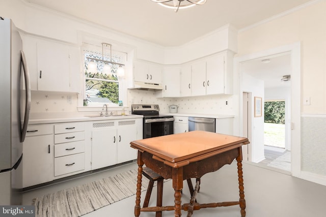 100 Wall St, Queenstown, MD 21658 - kitchen with a sink, white cabinetry, ornamental molding, and appliances with stainless steel finishes