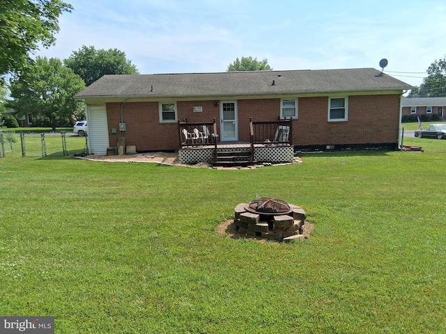 113 Meadowlark Ln, Stephens City, VA 22655 - rear view of property with an outdoor fire pit, a deck, and brick siding