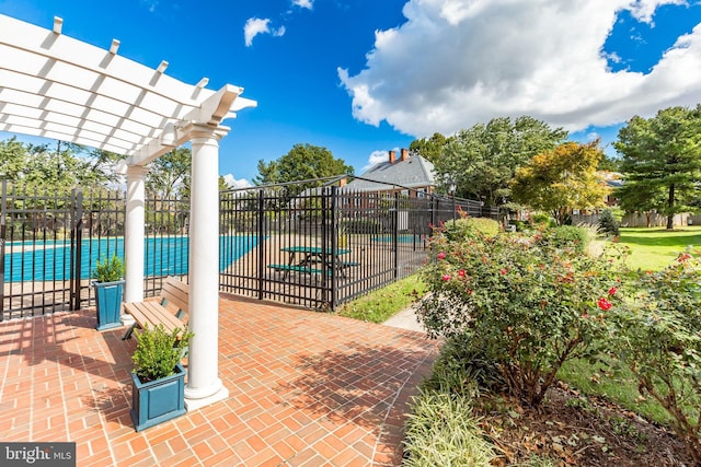exterior space with a pergola, fence, and a patio