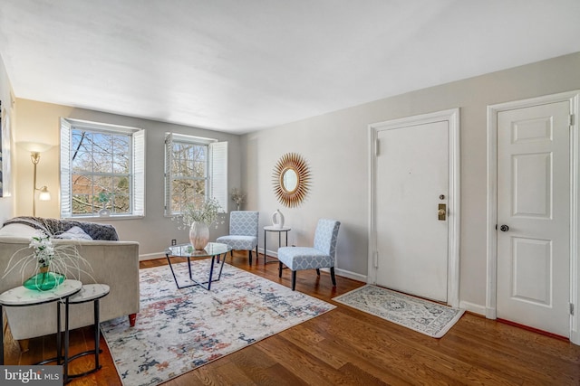 interior space featuring baseboards and wood finished floors