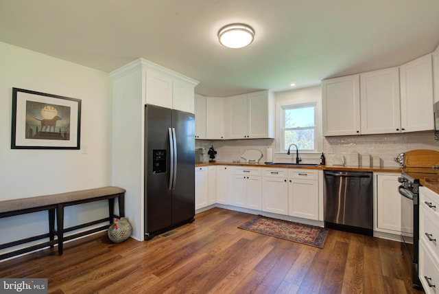 LOTA Middle Road, Winchester, VA 22602 - kitchen with tasteful backsplash, dark wood-style flooring, a sink, white cabinetry, and stainless steel appliances