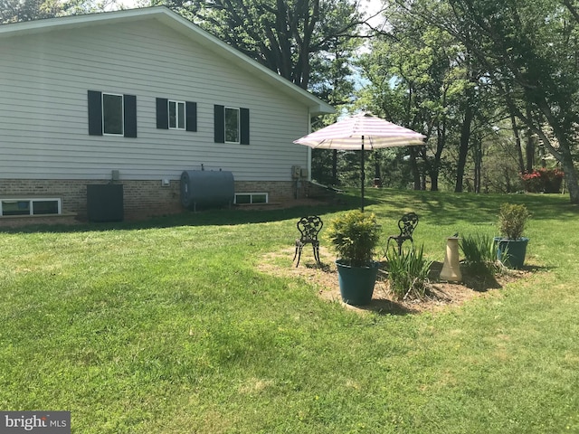 8012 Exodus Dr, Gaithersburg, MD 20882 - rear view of property with heating fuel and a lawn