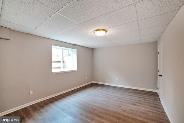 8012 Exodus Dr, Gaithersburg, MD 20882 - empty room with a paneled ceiling, dark wood-style flooring, and baseboards