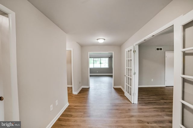 8012 Exodus Dr, Gaithersburg, MD 20882 - hall with wood finished floors, french doors, and baseboards