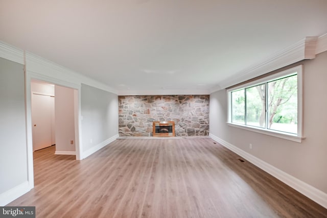 8012 Exodus Dr, Gaithersburg, MD 20882 - unfurnished living room with ornamental molding, wood finished floors, and baseboards