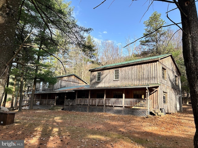 385 Elk Crk, Aaronsburg, PA 16820 - view of front of home featuring covered porch, a gambrel roof, and metal roof