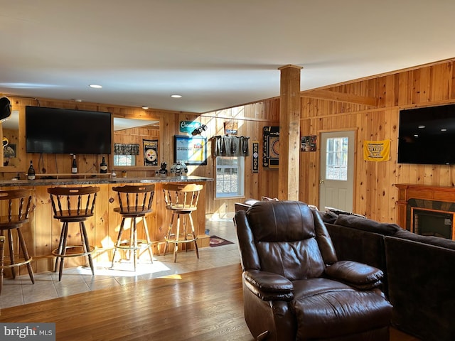 385 Elk Crk, Aaronsburg, PA 16820 - living room featuring light wood-type flooring and wooden walls