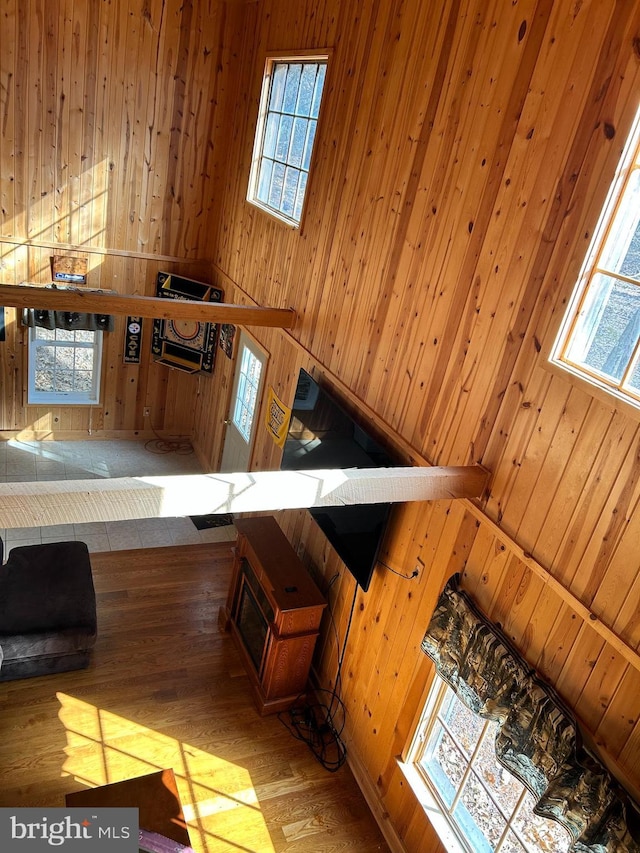 385 Elk Crk, Aaronsburg, PA 16820 - unfurnished living room with wood finished floors and wood walls
