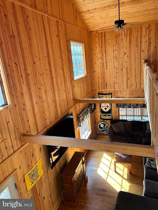 385 Elk Crk, Aaronsburg, PA 16820 - living area featuring lofted ceiling, wooden ceiling, wooden walls, ceiling fan, and wood finished floors
