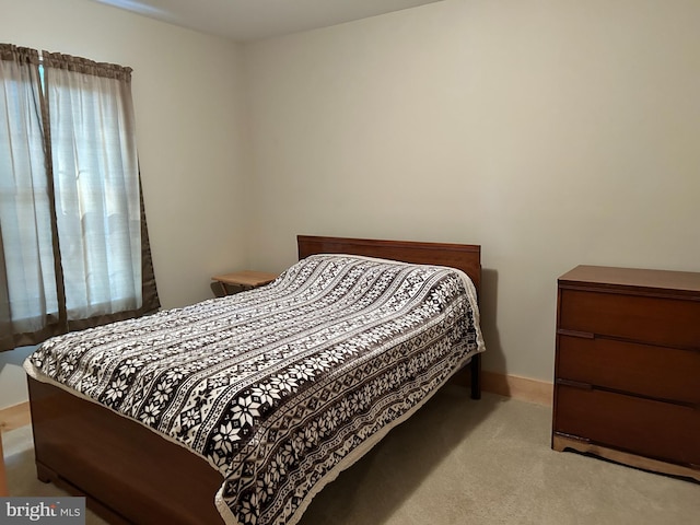 385 Elk Crk, Aaronsburg, PA 16820 - carpeted bedroom with baseboards and multiple windows