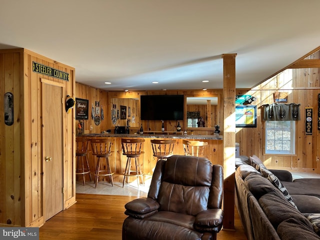 385 Elk Crk, Aaronsburg, PA 16820 - living area featuring wood finished floors, wood walls, indoor wet bar, recessed lighting, and ornate columns