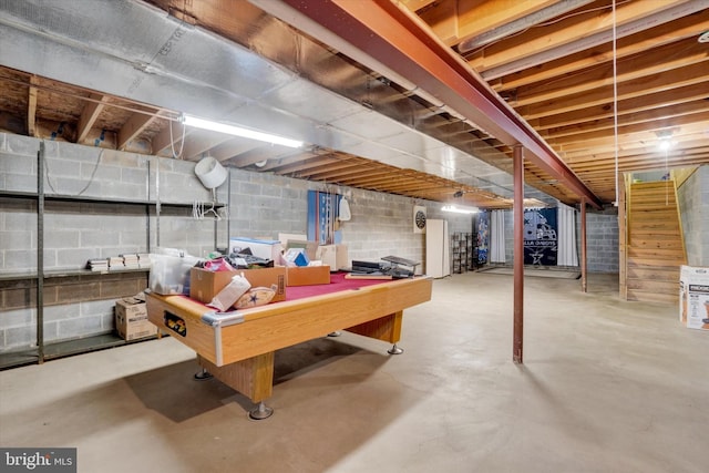 unfinished basement with billiards