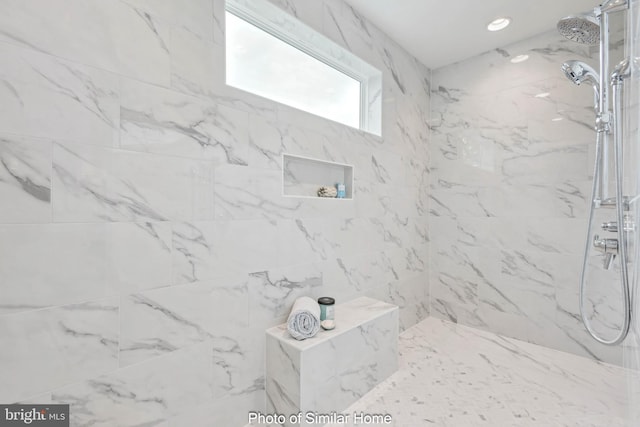 full bathroom with a marble finish shower