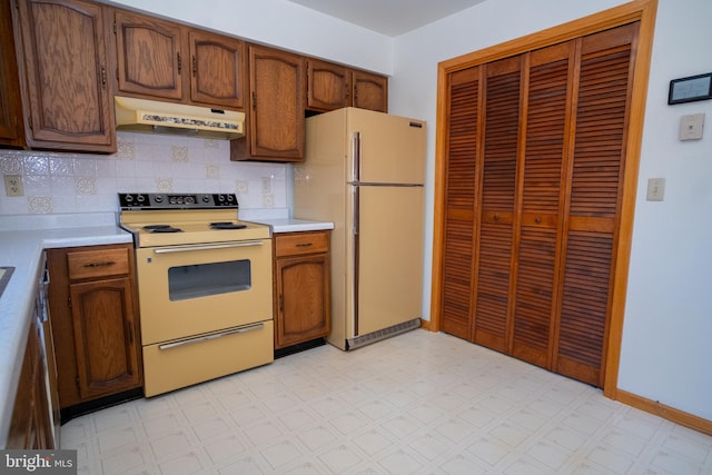 216 Shaw St Unit A10, Frostburg, MD 21532 - kitchen featuring under cabinet range hood, light floors, white appliances, and light countertops