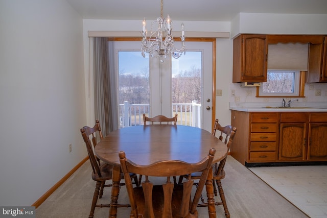 216 Shaw St Unit A10, Frostburg, MD 21532 - dining room featuring a notable chandelier, baseboards, and plenty of natural light