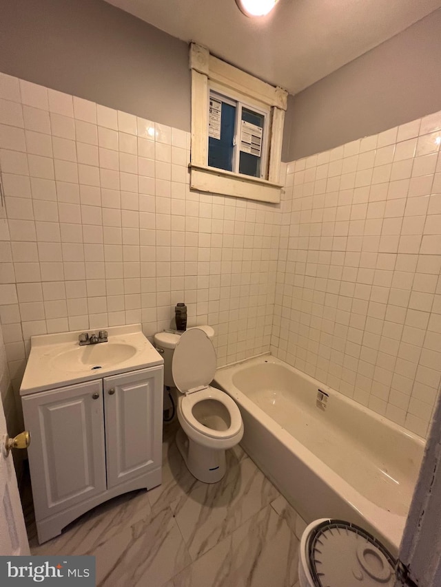 211 S Hilton St, Baltimore, MD 21229 - bathroom featuring tile walls, toilet, a bath, marble finish floor, and vanity