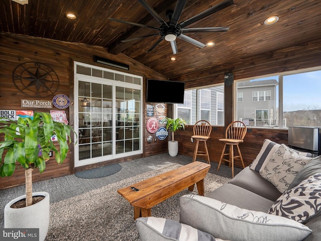 sunroom with recessed lighting, wooden ceiling, carpet floors, wooden walls, and vaulted ceiling with beams