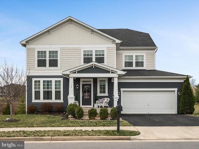view of front of property with driveway and a garage