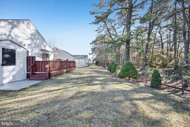 view of yard with a deck