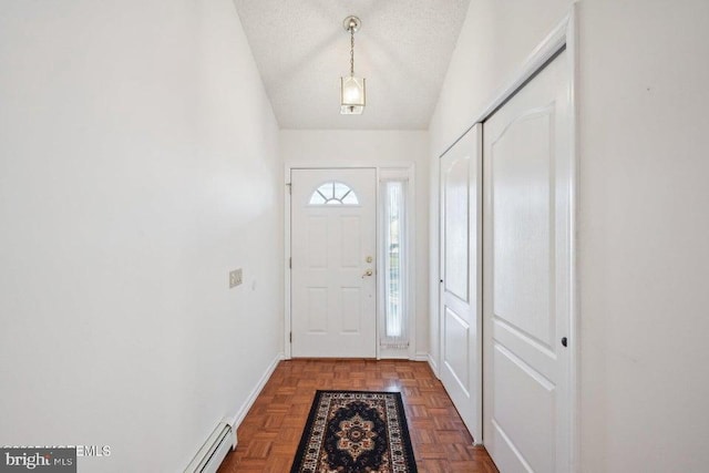 entryway featuring baseboards and a textured ceiling
